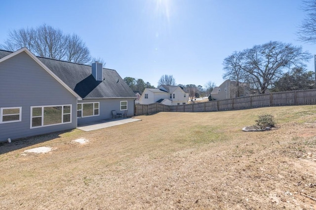 view of yard featuring a patio area and a fenced backyard