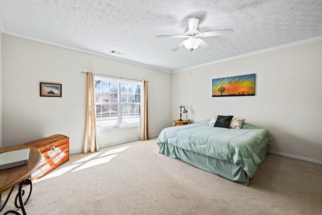 carpeted bedroom featuring ceiling fan, a textured ceiling, visible vents, and crown molding