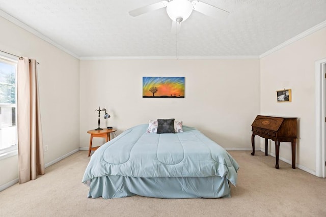 bedroom with ceiling fan, carpet floors, ornamental molding, and baseboards