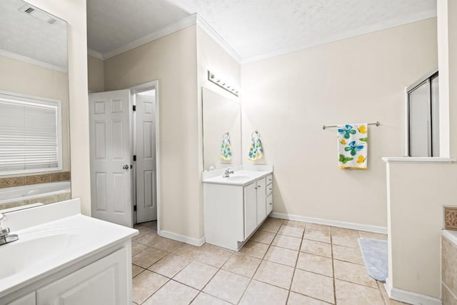 bathroom with two vanities, tile patterned flooring, and a sink