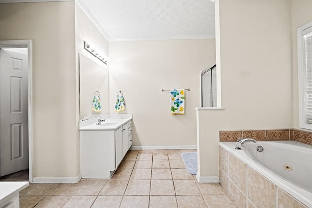 full bathroom featuring a jetted tub, vanity, baseboards, and tile patterned floors