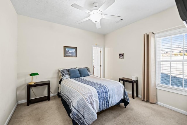 bedroom with carpet flooring, ceiling fan, visible vents, and baseboards