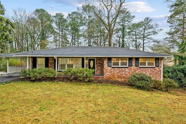 single story home with a carport and a front lawn