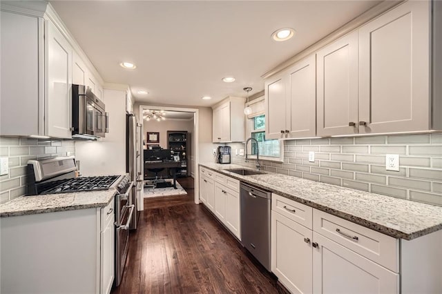 2917 Townley Cir, Atlanta, GA 30340 - kitchen featuring stainless steel appliances, a sink, recessed lighting, and white cabinetry