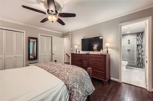 2917 Townley Cir, Atlanta, GA 30340 - bedroom featuring two closets, connected bathroom, dark wood-type flooring, baseboards, and ornamental molding