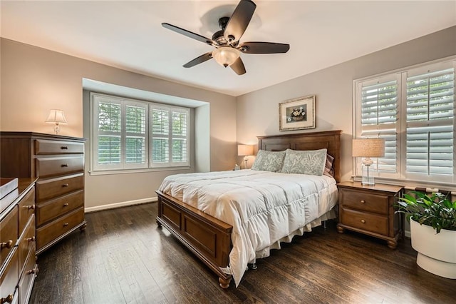 2917 Townley Cir, Atlanta, GA 30340 - bedroom with multiple windows, dark wood-type flooring, baseboards, and ceiling fan