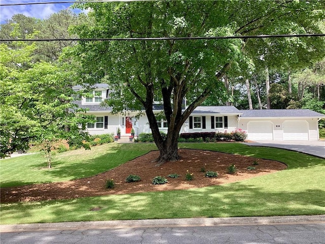 2917 Townley Cir, Atlanta, GA 30340 - obstructed view of property featuring a garage, a front yard, and asphalt driveway