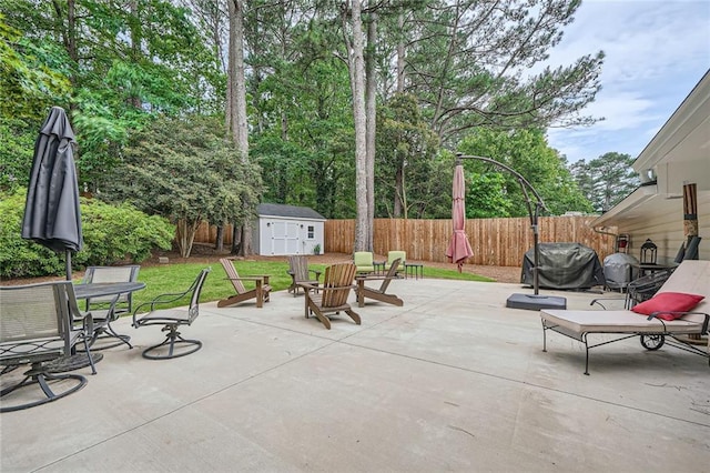 2917 Townley Cir, Atlanta, GA 30340 - view of patio featuring a storage unit, an outdoor structure, fence, and area for grilling