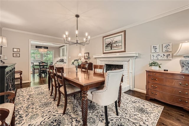 2917 Townley Cir, Atlanta, GA 30340 - dining area featuring ornamental molding, a chandelier, dark wood-style flooring, a brick fireplace, and baseboards