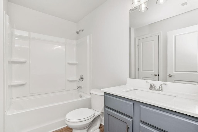 full bathroom featuring vanity, wood-type flooring, tub / shower combination, and toilet