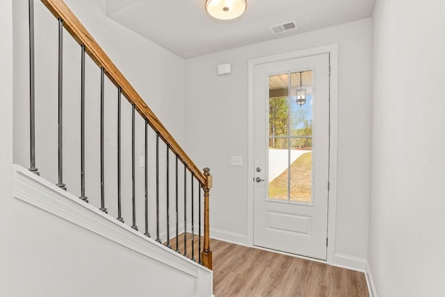 entrance foyer with light hardwood / wood-style floors