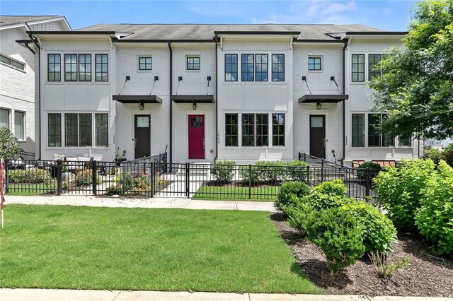 1954 Summit Trace Cir NW, Atlanta, GA 30318 - townhome / multi-family property featuring brick siding and a fenced front yard