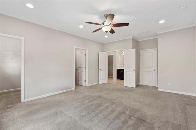 1954 Summit Trace Cir NW, Atlanta, GA 30318 - unfurnished bedroom with light carpet, a walk in closet, ornamental molding, recessed lighting, and a closet
