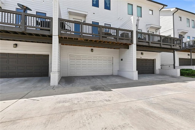 1954 Summit Trace Cir NW, Atlanta, GA 30318 - rear view of house with a garage and concrete driveway