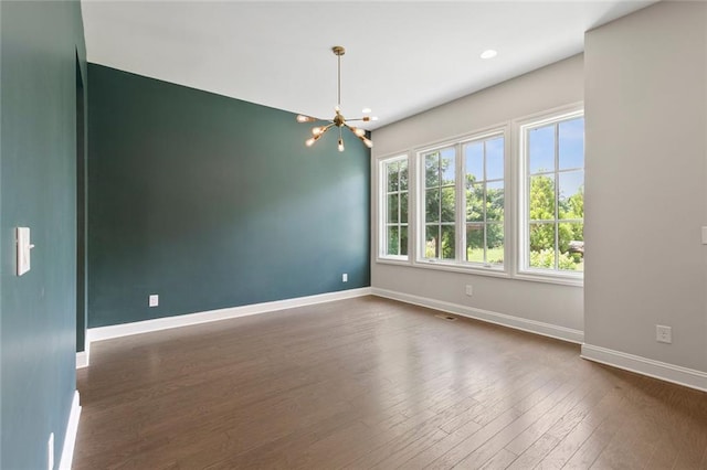 1954 Summit Trace Cir NW, Atlanta, GA 30318 - spare room with a chandelier, dark wood finished floors, and recessed lighting