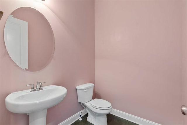 1954 Summit Trace Cir NW, Atlanta, GA 30318 - half bathroom featuring a sink and baseboards