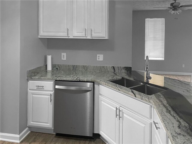 kitchen featuring light stone countertops, sink, stainless steel appliances, light hardwood / wood-style floors, and white cabinets