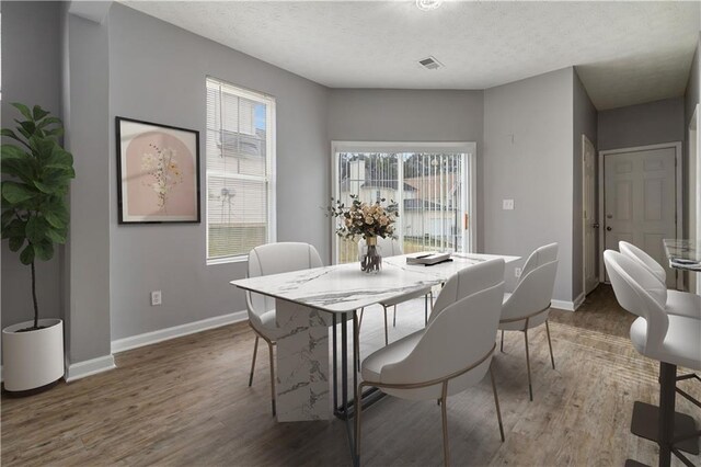 kitchen featuring white cabinets, sink, stainless steel dishwasher, ceiling fan, and light stone counters