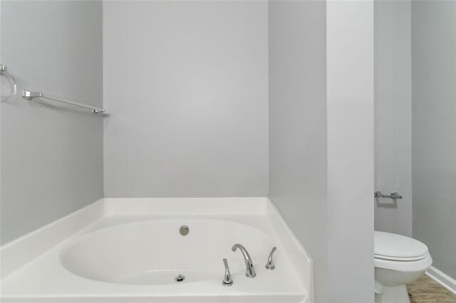 bathroom featuring wood-type flooring, vanity, and walk in shower