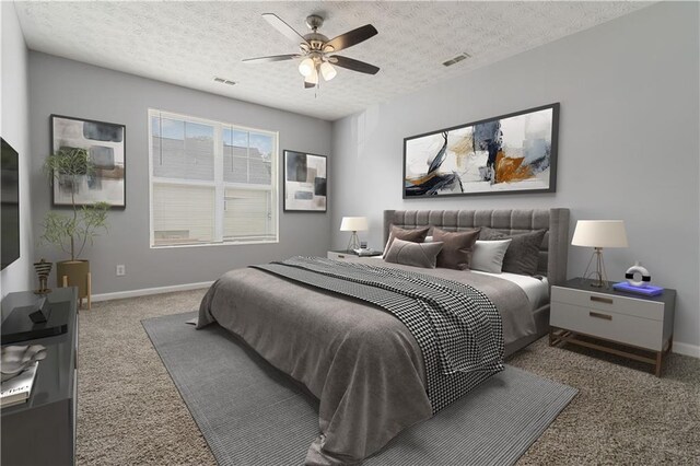 carpeted empty room with a textured ceiling