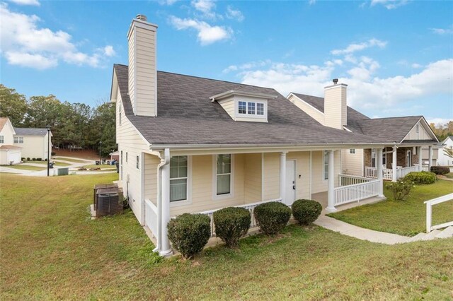 view of front of property with a front lawn and a garage