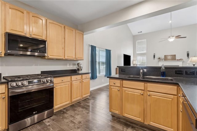 7927 Keepsake Ln, Flowery Branch, GA 30542 - kitchen with gas stove, lofted ceiling, light brown cabinetry, dark wood finished floors, and a ceiling fan