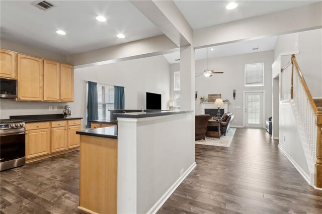 7927 Keepsake Ln, Flowery Branch, GA 30542 - living area featuring high vaulted ceiling, a fireplace, a ceiling fan, and dark wood-style floors