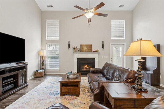 7927 Keepsake Ln, Flowery Branch, GA 30542 - living area featuring ceiling fan, high vaulted ceiling, wood finished floors, and recessed lighting