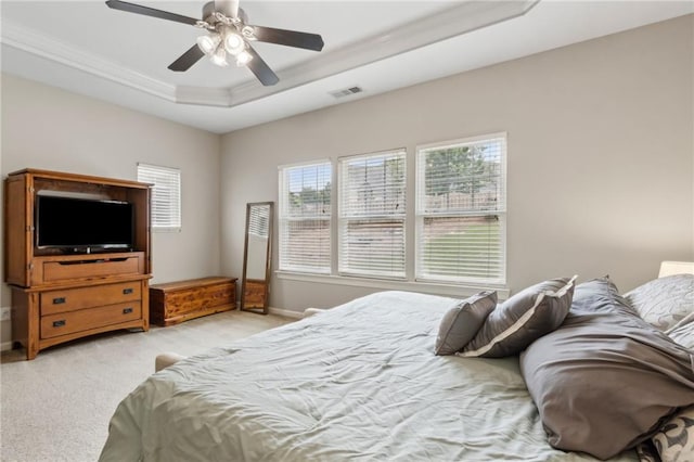 7927 Keepsake Ln, Flowery Branch, GA 30542 - bedroom with light colored carpet, a raised ceiling, ornamental molding, and ceiling fan