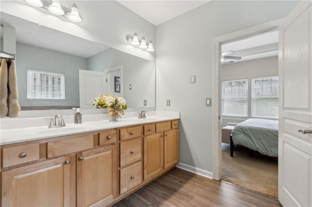 7927 Keepsake Ln, Flowery Branch, GA 30542 - full bathroom featuring double vanity, wood finished floors, and connected bathroom
