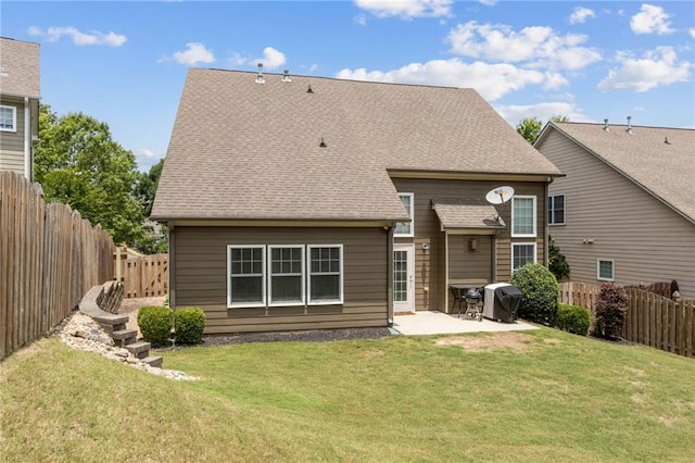7927 Keepsake Ln, Flowery Branch, GA 30542 - rear view of house featuring a patio area, a fenced backyard, and roof with shingles
