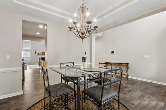 7927 Keepsake Ln, Flowery Branch, GA 30542 - dining room with dark wood-style floors, a chandelier, ornamental molding, and recessed lighting