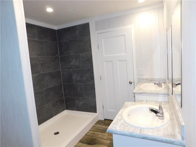 129 Lost Pl, Dahlonega, GA 30533 - bathroom featuring vanity, tiled shower, wood finished floors, and recessed lighting