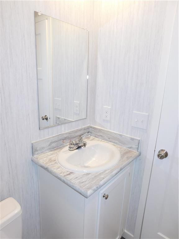 129 Lost Pl, Dahlonega, GA 30533 - half bathroom featuring vanity and toilet