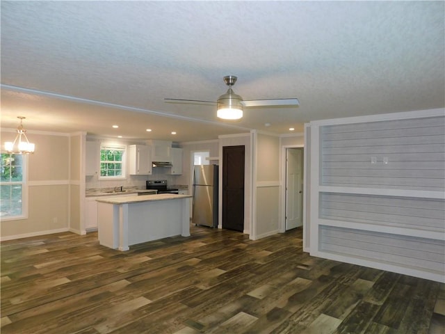 129 Lost Pl, Dahlonega, GA 30533 - kitchen with appliances with stainless steel finishes, white cabinets, a center island, a chandelier, and dark wood-type flooring