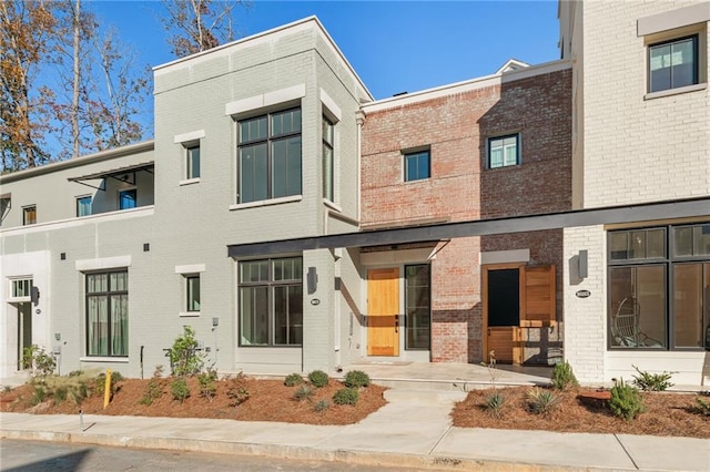 view of front of house featuring brick siding