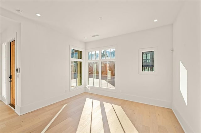 unfurnished room featuring light hardwood / wood-style flooring