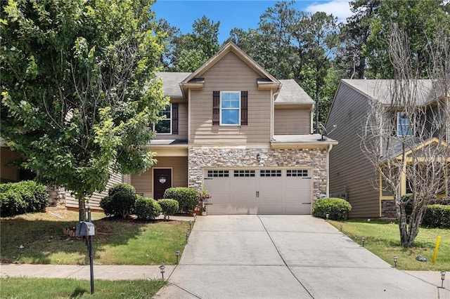 2780 Lakeview Walk, Decatur, GA 30035 - view of front of home with concrete driveway, a garage, stone siding, and a front yard