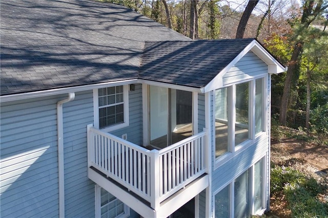 view of home's exterior featuring a garage and a balcony