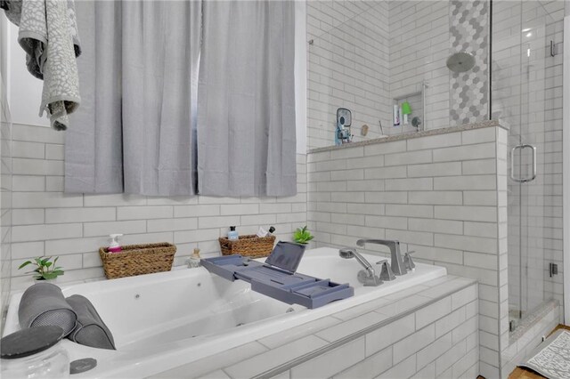 1033 Lanier Ave, Gainesville, GA 30501 - bathroom with a stall shower and a garden tub