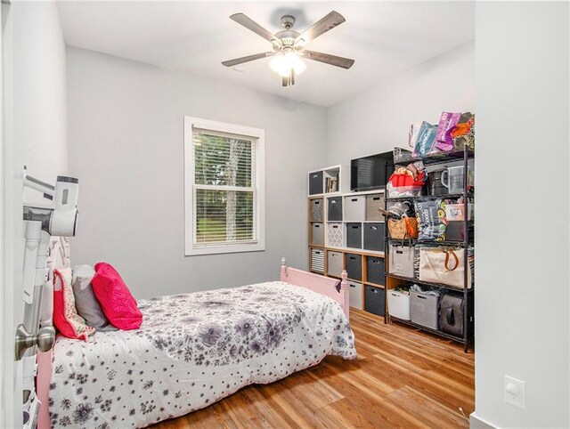 1033 Lanier Ave, Gainesville, GA 30501 - bedroom with wood finished floors and a ceiling fan