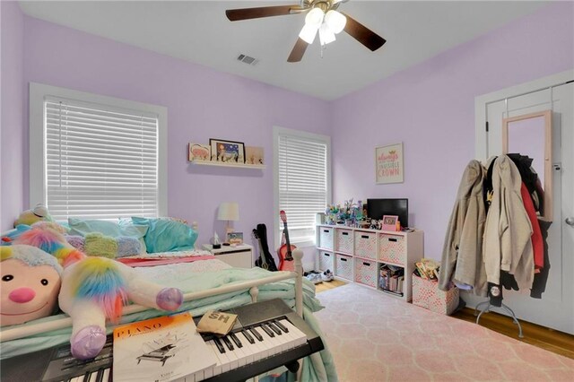 1033 Lanier Ave, Gainesville, GA 30501 - bedroom with a ceiling fan, visible vents, and wood finished floors