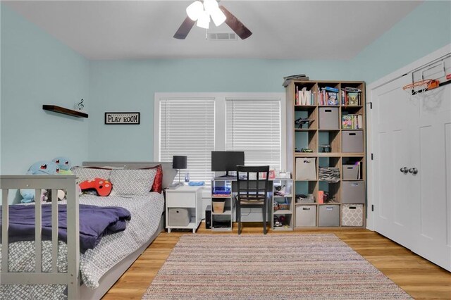 1033 Lanier Ave, Gainesville, GA 30501 - bedroom with wood finished floors, visible vents, and a ceiling fan