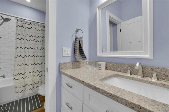 1033 Lanier Ave, Gainesville, GA 30501 - full bathroom featuring shower / bath combination with curtain, vanity, and toilet