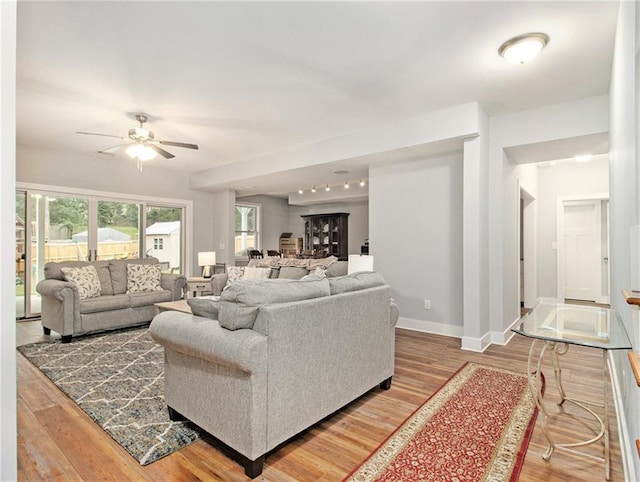 1033 Lanier Ave, Gainesville, GA 30501 - living area with ceiling fan, baseboards, and wood finished floors