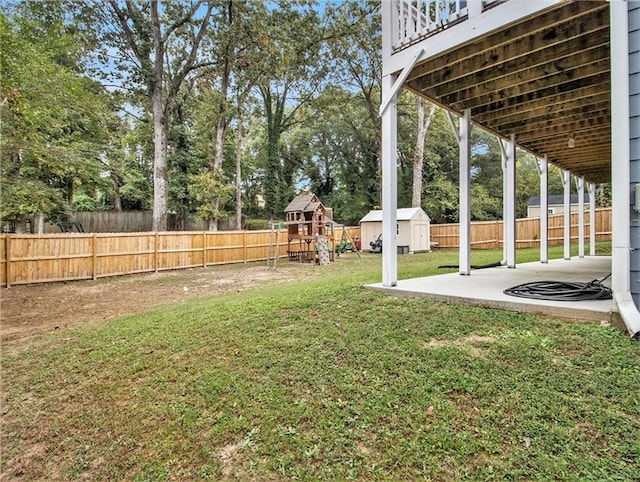 1033 Lanier Ave, Gainesville, GA 30501 - view of yard with a playground, a patio, a shed, a fenced backyard, and an outdoor structure