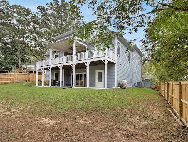 1033 Lanier Ave, Gainesville, GA 30501 - rear view of house featuring a fenced backyard, central AC unit, and a lawn