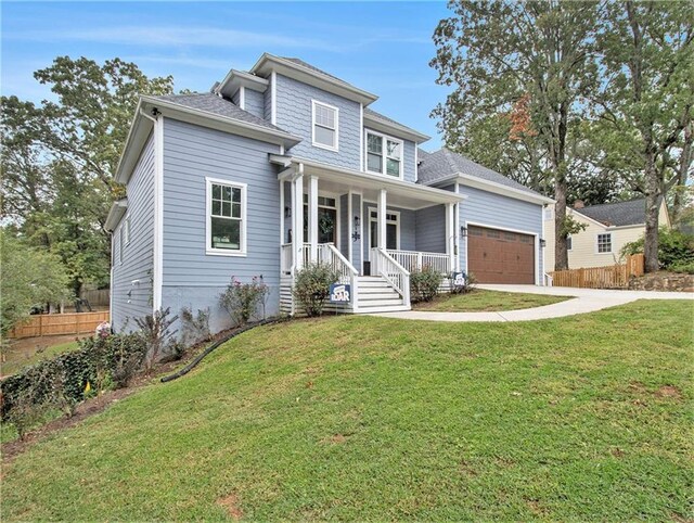 1033 Lanier Ave, Gainesville, GA 30501 - view of front of home featuring a porch, a garage, fence, driveway, and a front lawn