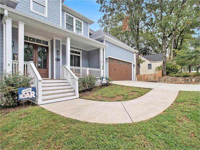 1033 Lanier Ave, Gainesville, GA 30501 - view of front of home featuring an attached garage, covered porch, and concrete driveway