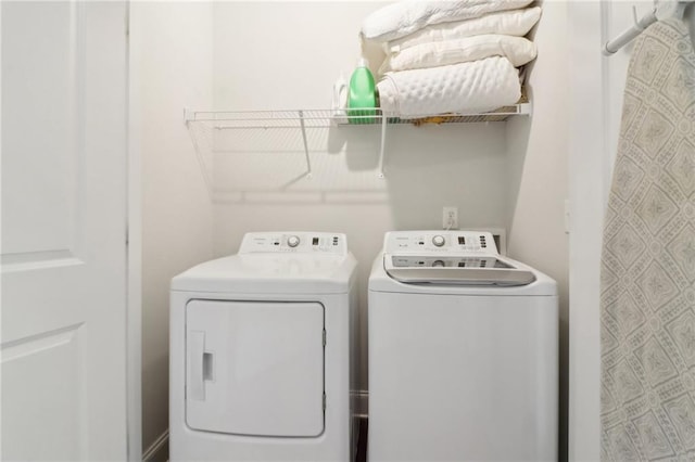 laundry area featuring laundry area and washing machine and clothes dryer